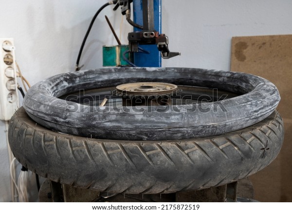 motorcycle tire repair process inner tube\
installation stage selective\
focus