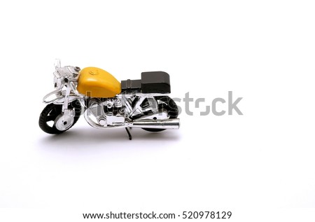 Motorcycle toy yellow on a white background.
