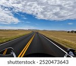 Motorcycle travel on the open road in the mid-west on a summer day - South Dakota and Wyoming