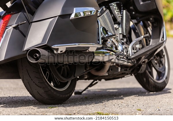 motorcycle wheel and transmission belt with\
lubrication close up, moto disc. outdoor on  street. bike riding.\
Sport rock lifestyle transport. Close up front wheel of a\
motorcycle.. Enjoying of\
freedom
