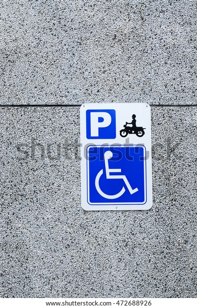 Motorcycle and wheelchair \
parking sign