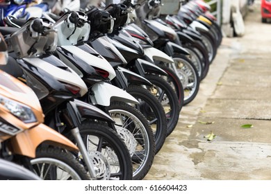 Motorcycles standing in the row at a store, closeup