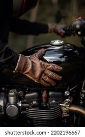 Motorcyclist In Brown Leather Gloves. Vintage Wallpaper