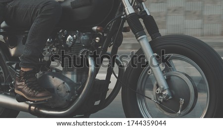 Similar – Image, Stock Photo Black motorcycle on road over nature background