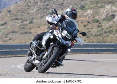 Motorcyclist Enjoying His Bike In The Corner. Photograph Taken In The Port Of Navalmoral, Avila, Spain, During The Month Of October 2021

