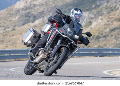 Motorcyclist Enjoying His Bike In The Corner. Photograph Taken In The Port Of Navalmoral, Avila, Spain, During The Month Of October 2021

