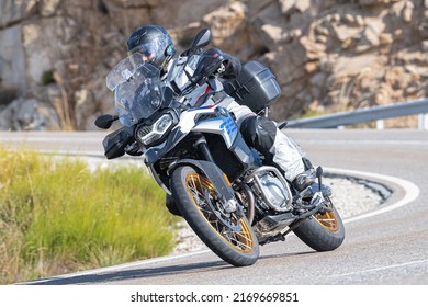 Motorcyclist Enjoying His Bike In The Corner. Photograph Taken In The Port Of Navalmoral, Avila, Spain, During The Month Of October 2021

