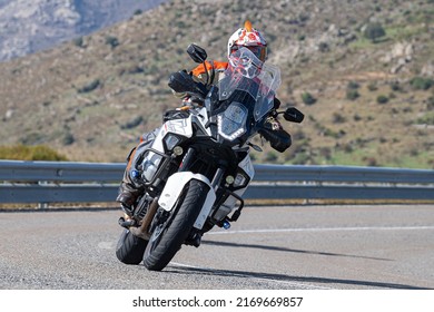 Motorcyclist Enjoying His Bike In The Corner. Photograph Taken In The Port Of Navalmoral, Avila, Spain, During The Month Of October 2021

