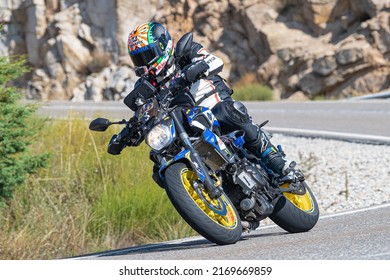 Motorcyclist Enjoying His Bike In The Corner. Photograph Taken In The Port Of Navalmoral, Avila, Spain, During The Month Of October 2021

