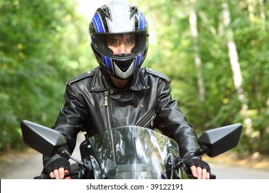 Motorcyclist Goes On Road, Front View, Closeup