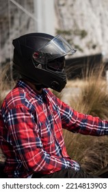 Motorcyclist Man With A Black Helmet