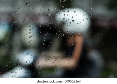 Motorcyclist In The Rain