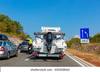 Motorhome with ? motor boat on the automotive trailer on the road in Istria, Croatia