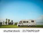 motorhome on a camping ground, caravan vacations, campervan trip. High quality photo