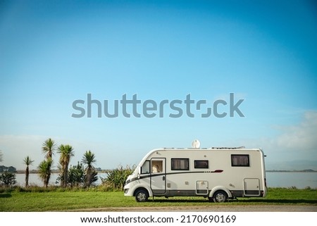 motorhome on a camping ground, caravan vacations, campervan trip. High quality photo
