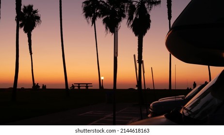 Motorhome Trailer, Caravan For Road Trip, Palm Trees On Beach At Sunset, California Coast, USA. Camper Van RV Motor Home In Beachfront Park At Sundown, San Diego, Mission Beach. Mobile Home Campervan.