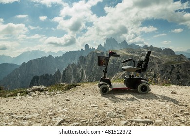 motorised wheelchair for disposable people, Mobile electric buggies on the mountain, Dolomites, Italy. disable car 