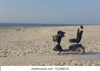motorised wheelchair for disposable people, Mobile electric buggies on island Ameland. Dutch.