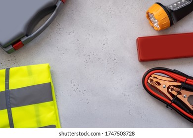 Motorist's Kit For Passing Technical Inspection , Emergency Stop Sign, First Aid Kit And Led Torch, Reflective Vest. Auto Accessories, Concept Car, Space For Youre Text. Flat Lay.