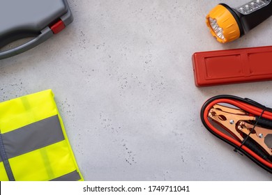 Motorist's Kit For Passing Technical Inspection , Emergency Stop Sign, First Aid Kit And Led Torch, Reflective Vest. Auto Accessories, Concept Car, Space For Youre Text. Flat Lay.