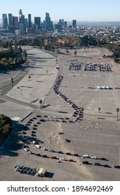 Motorists Wait In Lines To Get The Coronavirus (COVID-19) Vaccine In A Parking Lot At Dodger Stadium, Friday, Jan. 15, 2021, In Los Angeles. 