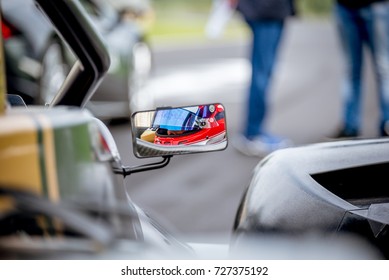 Motorsport Car Driver Detail On Rear View Mirror Before Racing Start On Starting Grid