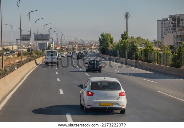 Motorway in algeria,\
around the city of Oran. View of cars in african city traveling on\
multi lane highway..