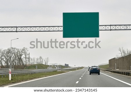 Similar – Motorway signpost to Berlin