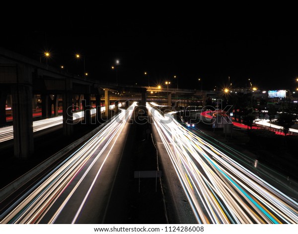 Motorway dark night road street sky\
speed car background light color line move movements\
fast
