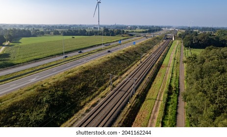 Motorway with few cars and railroad next to it, near the exit of Brecht in Belgium, Europe. High quality photo