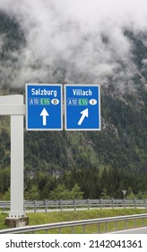 motorway junction with large signs indicating the border cities of Salzburg in Austria and Villach towards the Italian border