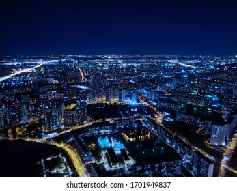 Motorway And Residential Area Of The City In The Night Aerial View