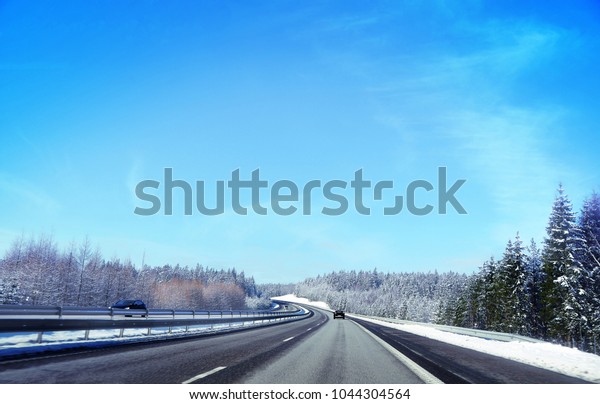 Motorway in Sweden during Winter (R40). Sunny day and\
blue sky. 