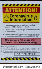 Motueka High Street, South Island, New Zealand, March 25 2020: Sign On A Shop Door In Response To Covid 19 Pandemic Outlining Symptoms Of The Virus And Asking You Not To Enter If Showing Any