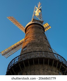Moulton Windmill, near Spalding in Lincolnshire in low summer sun at golden hour under a clear blue sky
