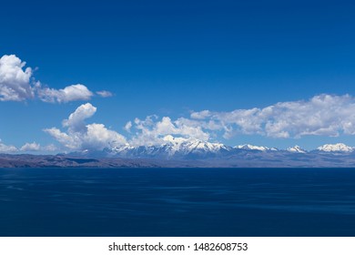 The mounain range of the Andes along the shore of Lake Titicaca in Bolivia viewed from the popular tourist destination of Isla del Sol (Island of the Sun)