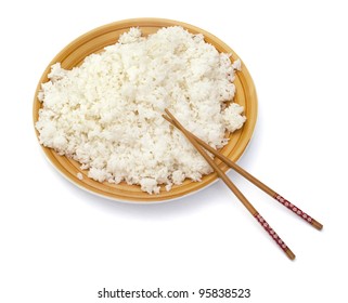 Mound Of Cooked Rice In A Big Yellow Bowl And Chinese Sticks