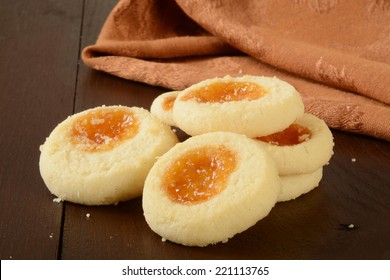 A Mound Of Shortbread Cookies With Apricot Filling