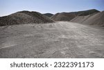 mounds of piled earth gravel as a background