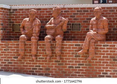 Mount Airy, North Carolina / USA - July 5, 2020: “The Whittling Wall” Brick Sculptures By Artist Brad Spencer Recognizes Fiddle Player Tommy Jarrell, Banjo Player Fred Cockerham, And Ralph Epperham. 