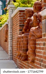 Mount Airy, North Carolina / USA - July 5, 2020: “The Whittling Wall” Brick Sculptures By Artist Brad Spencer Recognizes Fiddle Player Tommy Jarrell, Banjo Player Fred Cockerham, And Ralph Epperham. 