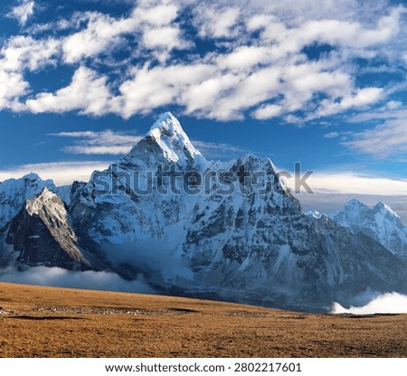 Mount Ama Dablam, Evening view of mount Ama Dablam peak with clouds on sky, Mount Everest base camp trekking trail, Khumbu valley, Solukhumbu, Nepal Himalaya mountain