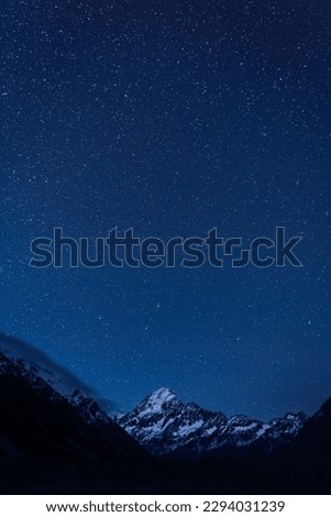 Mount Aoraki and starry sky at night seen from the Kea Point of Aoraki Mount Cook National Park in New Zealand