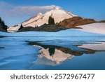 Mount Baker reflected in Goat Lake on Ptarmigan Ridge. Mount Baker Wilderness, North Cascades, Washington State