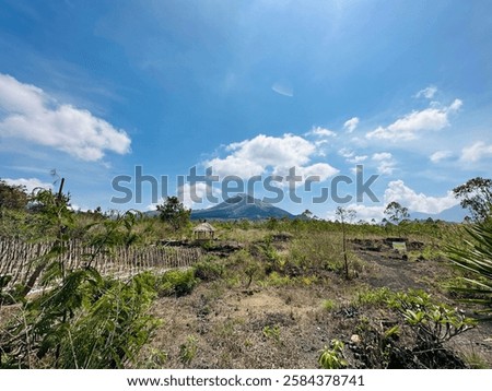 Mount Batur is an active volcano located at the center of two concentric calderas northwest of Mount Agung on the island of Bali, Indonesia.; black sand, Volcano Black Lava