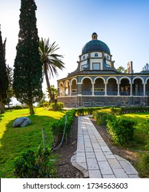 The Mount Bliss on the Sea of Galilee. Israel. Catholic Church of the Beatitudes of the Franciscan monastery. Blooming huge park around the monastery. The concept of religious pilgrimage 