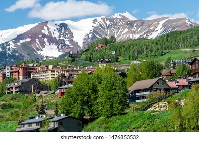 Mount Crested Butte Snow Marooon Color Mountain In Summer With Green Lush Color On Hills And Houses Cityscape