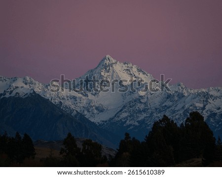 Mount D'Archiac idyllic remote rural countryside early morning golden hour purple red sky winter sunrise at Lake Camp, Southern Alps mountain landscape at Ashburton Lakes Canterbury New Zealand