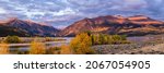 Mount Elbert and Mount Consgriff lit by the early morning light above Twin Lakes at the beginning of Autumn in Colorado.