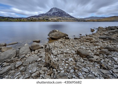 Mount Errigal, Co. Donegal, Ireland, Reflected In Blue Lake Surrounded By Peatland In National Park